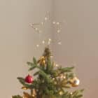 Gouden piek voor de kerstboom met lichtjes