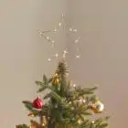 Gouden piek voor de kerstboom met lichtjes